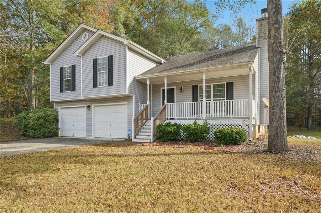 480 Raider Way Bethlehem, GA 30620 - Photo 2 of 30 a front view of a house with a yard and garage