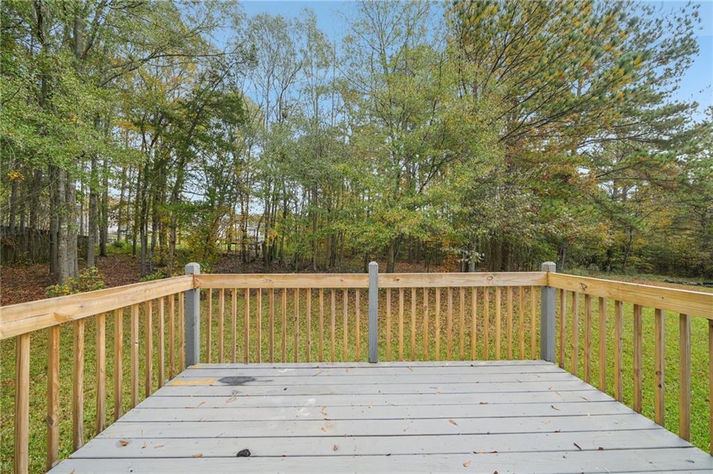 480 Raider Way Bethlehem, GA 30620 - Photo 23 of 30 a view of balcony with wooden floor and fence