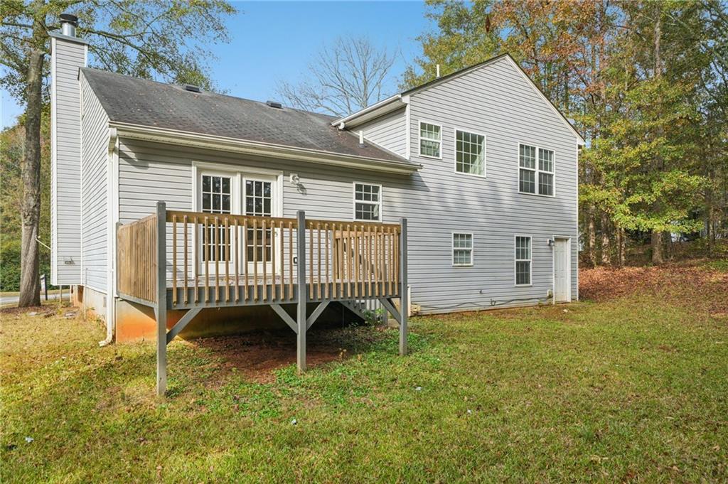 480 Raider Way Bethlehem, GA 30620 - Photo 26 of 30 a view of a house with a yard and deck