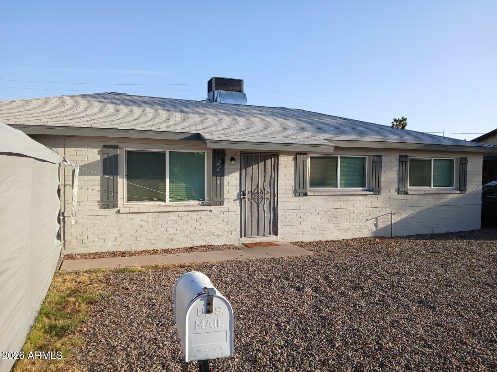 2431 West Seldon Lane Phoenix, AZ 85021 - Photo 2 of 8 a front view of a house with windows