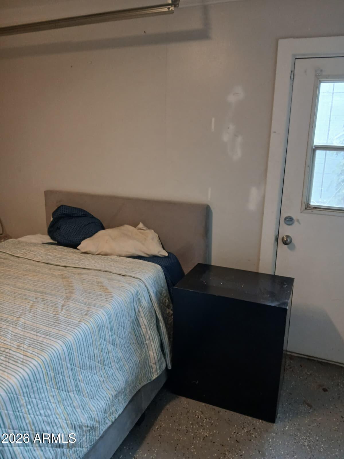 2431 West Seldon Lane Phoenix, AZ 85021 - Photo 5 of 8 a bedroom with a bed and a window