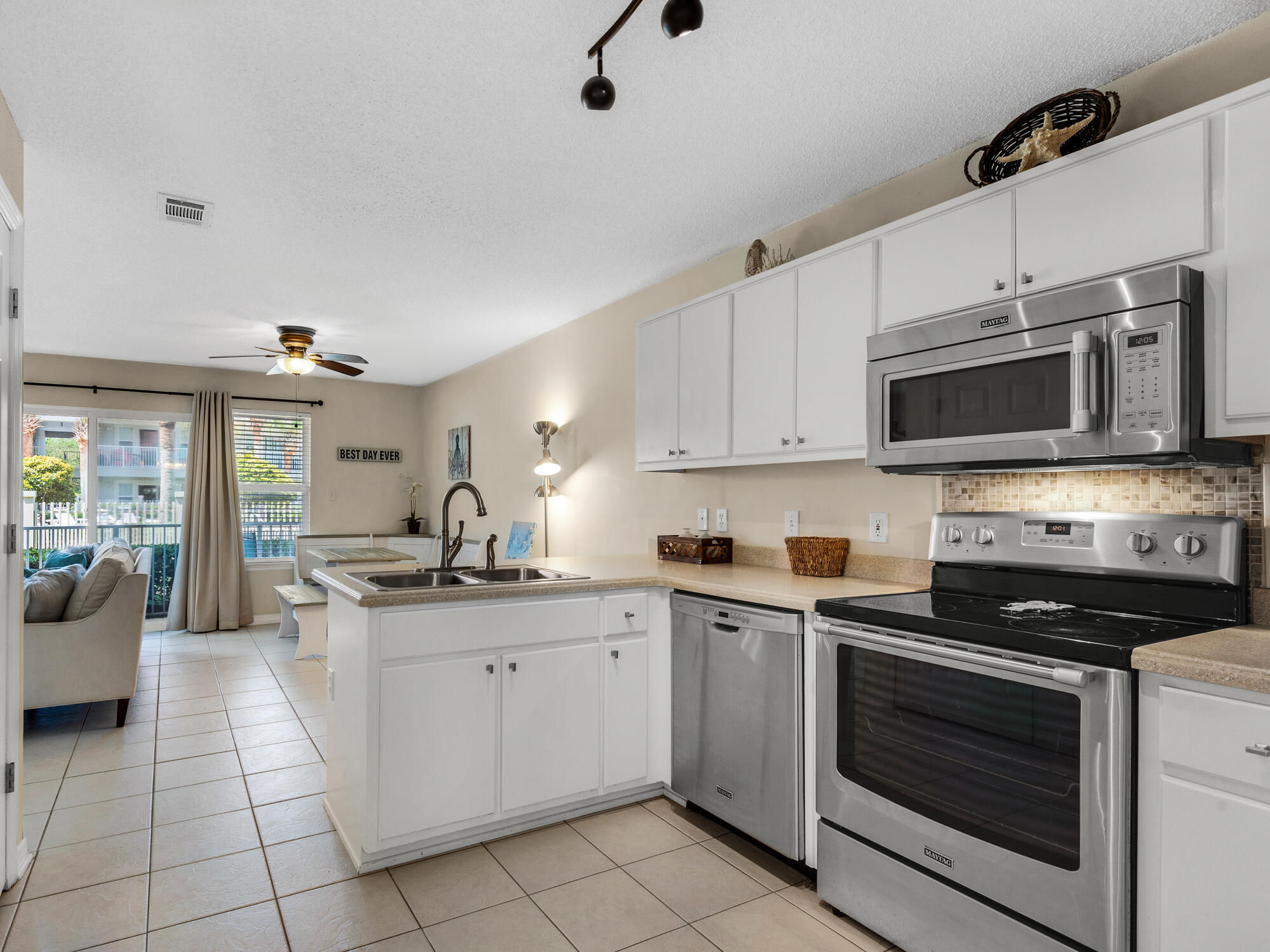 82 Sugar Sand Lane, Unit C2 Santa Rosa Beach, FL 32459 - Photo 11 of 34 a kitchen with a sink stove and cabinets