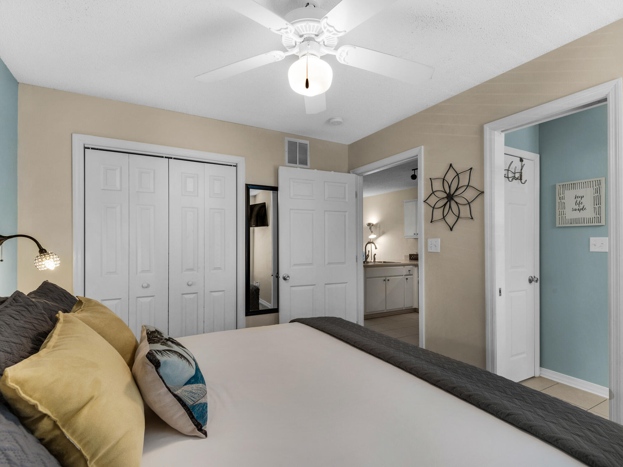 82 Sugar Sand Lane, Unit C2 Santa Rosa Beach, FL 32459 - Photo 15 of 34 a bedroom with a bed and a chandelier