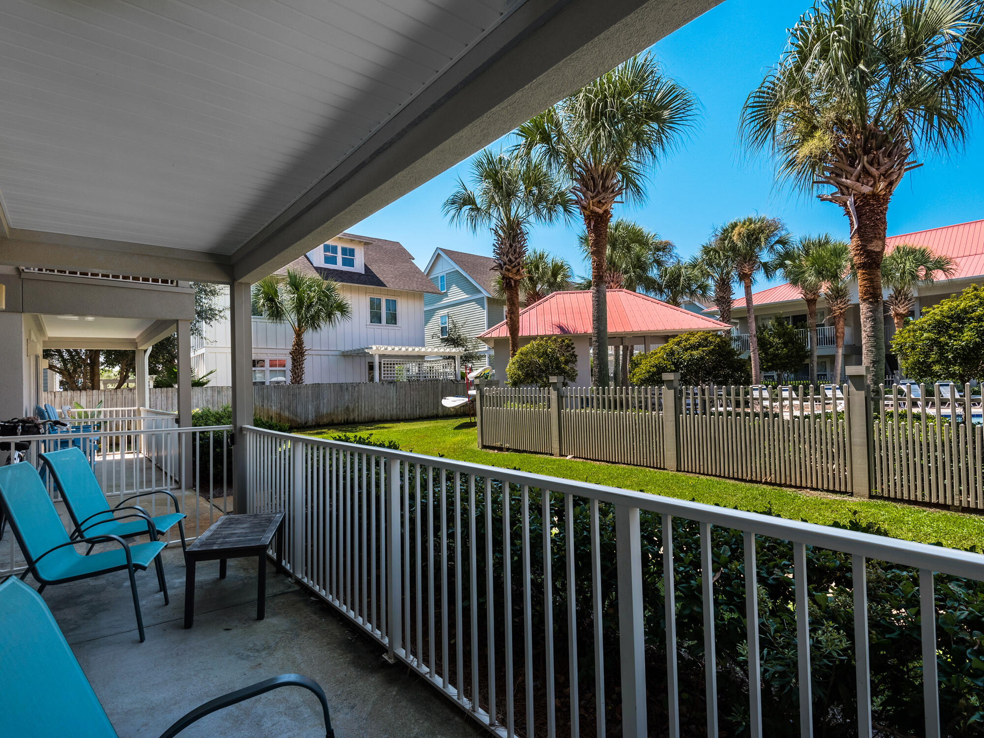 82 Sugar Sand Lane, Unit C2 Santa Rosa Beach, FL 32459 - Photo 18 of 34 a balcony with table and chairs