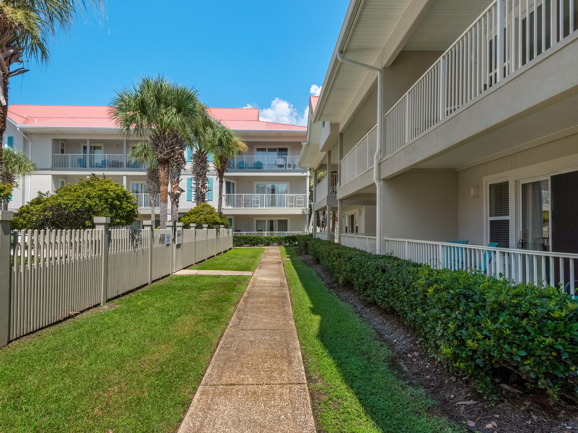 82 Sugar Sand Lane, Unit C2 Santa Rosa Beach, FL 32459 - Photo 22 of 34 a view of a building with a yard
