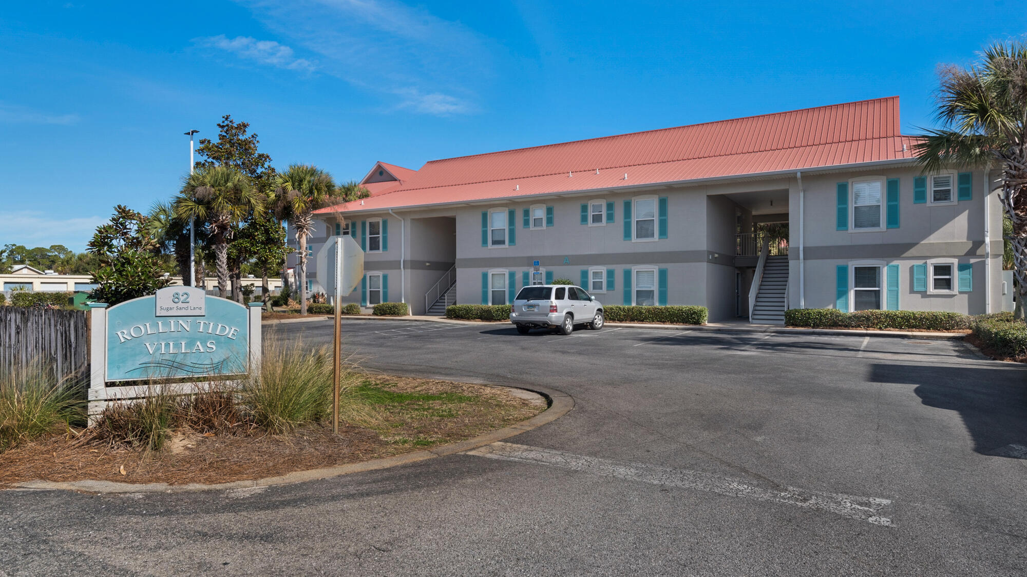 82 Sugar Sand Lane, Unit C2 Santa Rosa Beach, FL 32459 - Photo 24 of 34 a front view of a building with garden