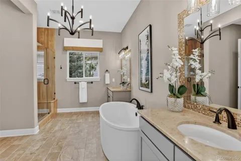 a spacious bathroom with a granite countertop sink a toilet and shower