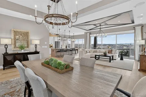 a living room with lots of furniture and kitchen view