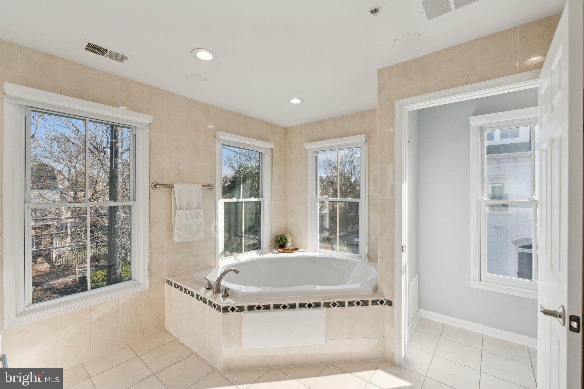 5334 43rd Street Northwest Washington, DC 20015 - Photo 15 of 32 a spacious bathroom with a tub and large windows