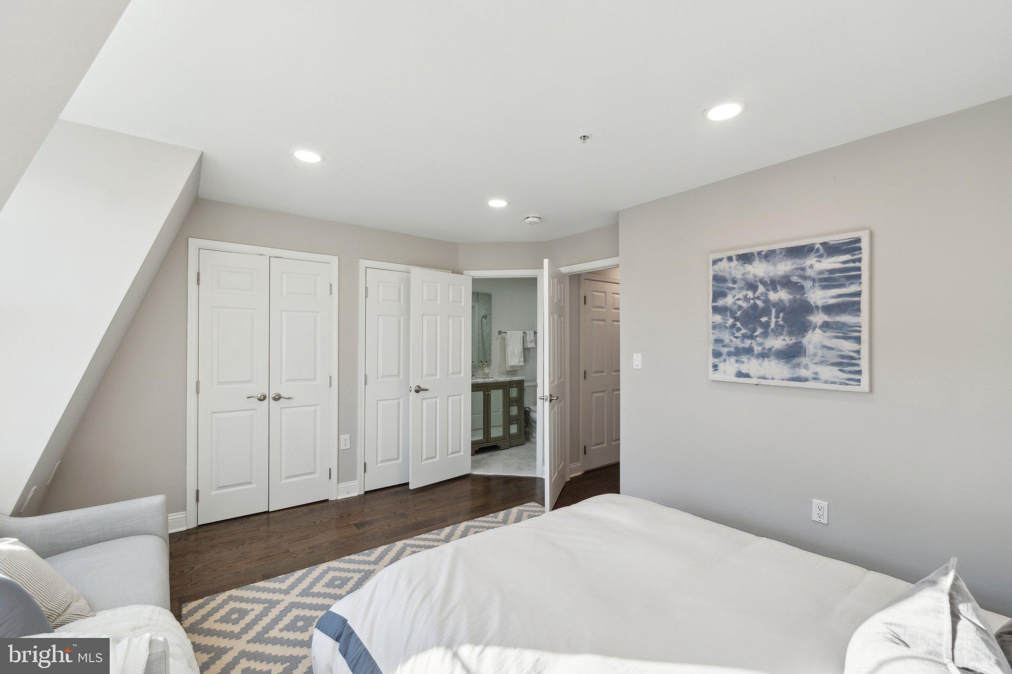 5334 43rd Street Northwest Washington, DC 20015 - Photo 19 of 32 a spacious bedroom with a bed and a couch