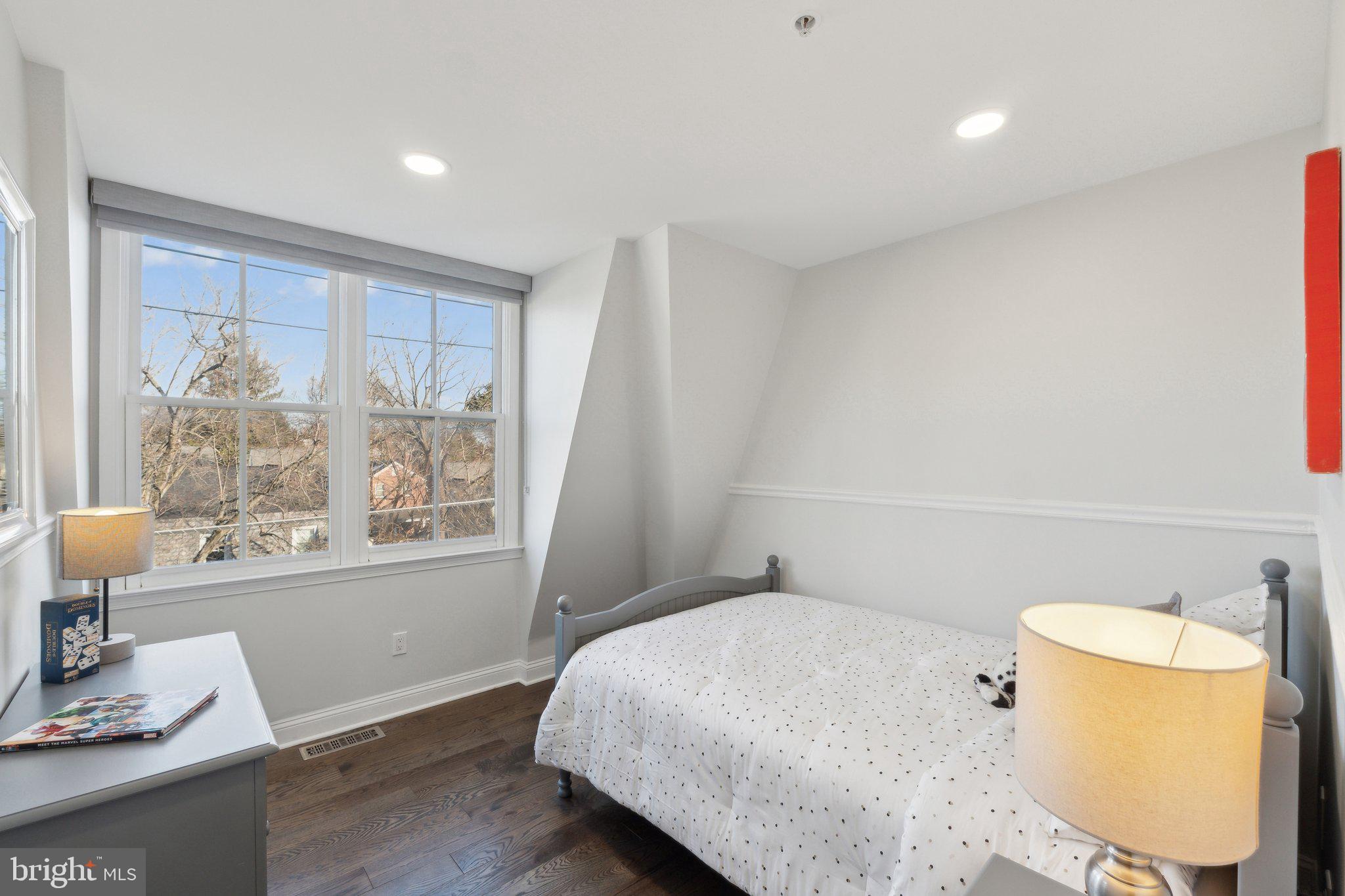 5334 43rd Street Northwest Washington, DC 20015 - Photo 21 of 32 a bedroom with a bed and wooden floor