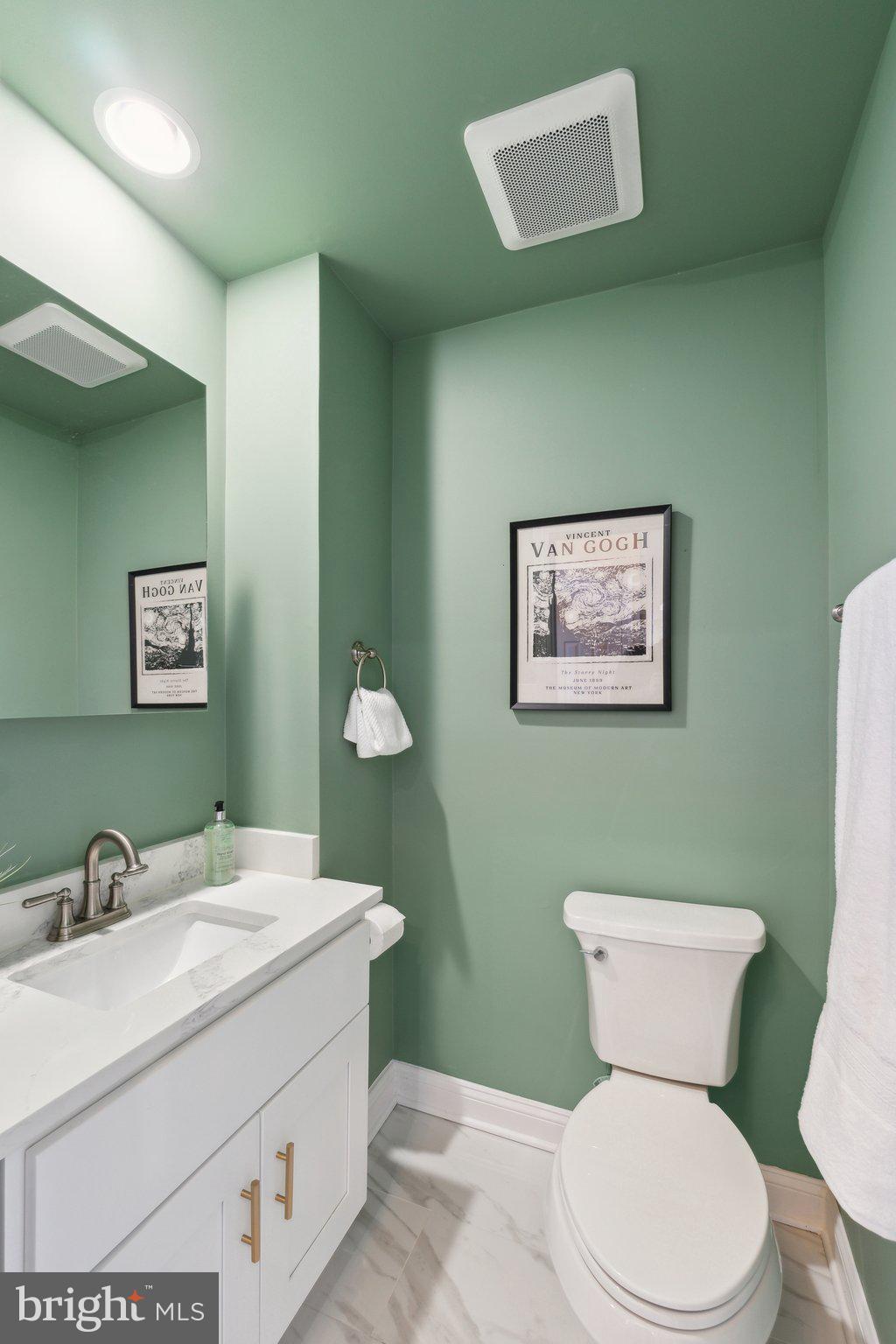 5334 43rd Street Northwest Washington, DC 20015 - Photo 8 of 32 a bathroom with a toilet sink and mirror