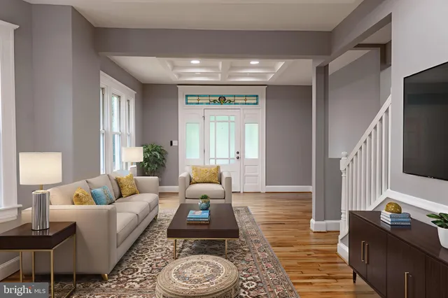 a living room with furniture and a window