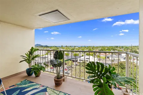 a view of a balcony with lake view and a potted plant