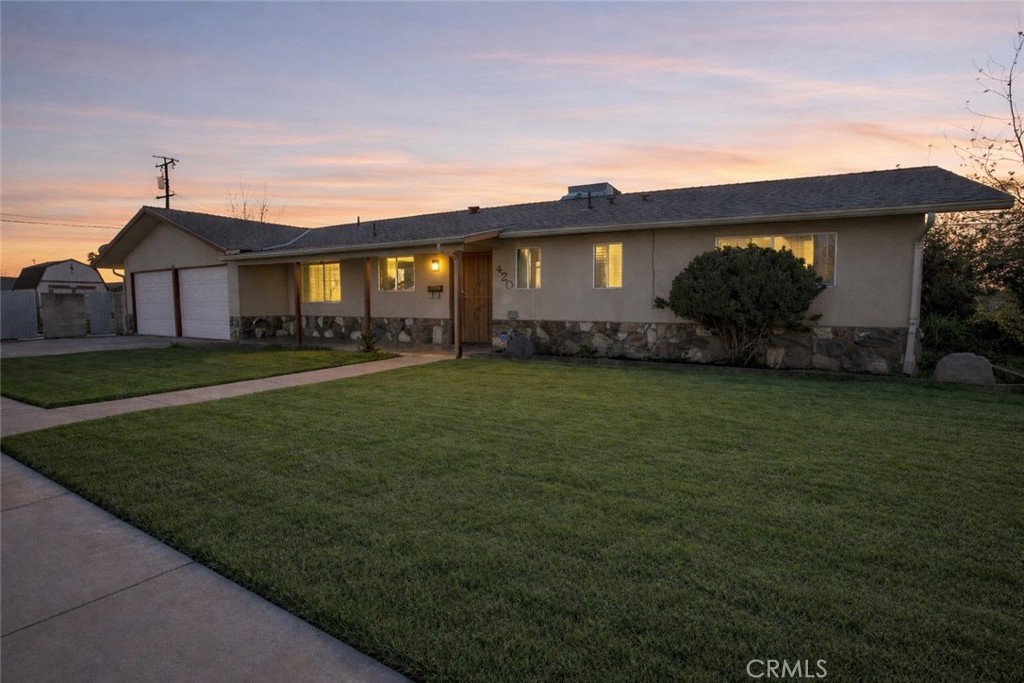 420 South 3rd Street Chowchilla, CA 93610 - Photo 1 of 1 a view of a yard in front of a house