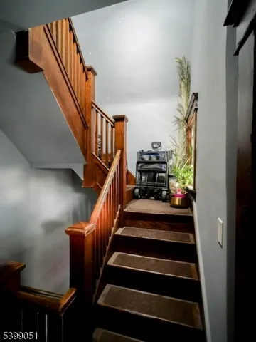 a view of deck with furniture and trees