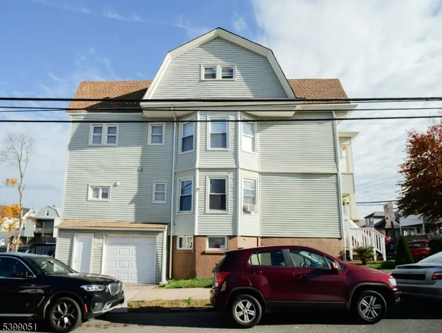 a front view of a house with parking space