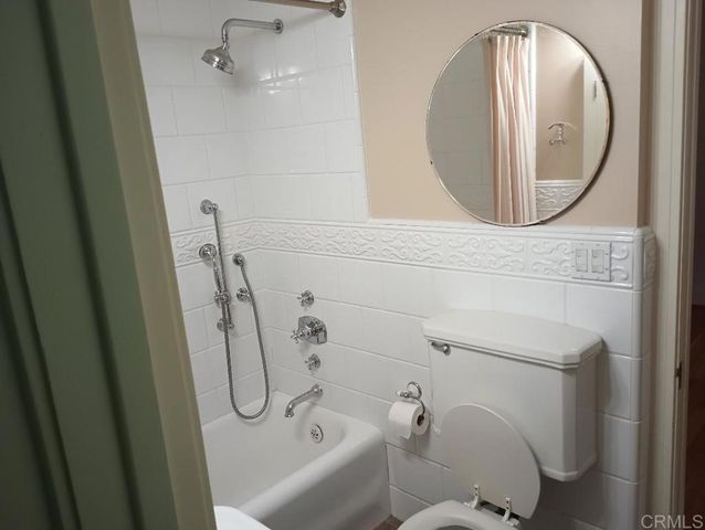 a bathroom with a toilet and a sink