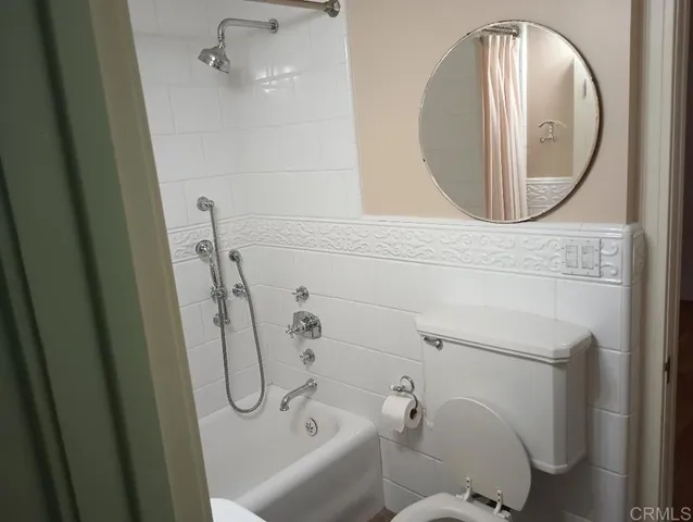 a bathroom with a toilet and a sink
