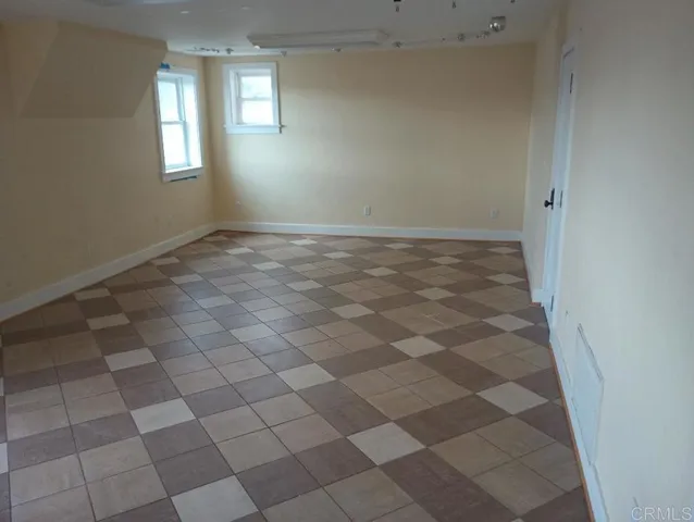 a view of an empty room and window