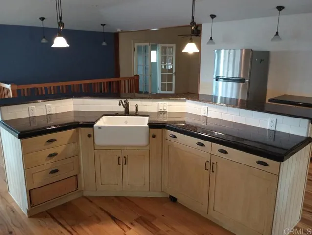 a bathroom with a sink double vanity and a mirror