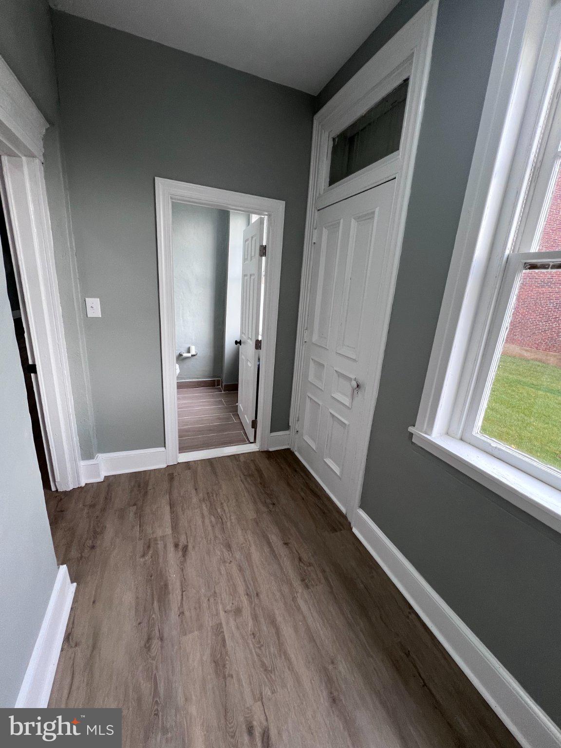 26 East 5th Street Pottstown, PA 19464 - Photo 12 of 37 an empty room with wooden floor and windows
