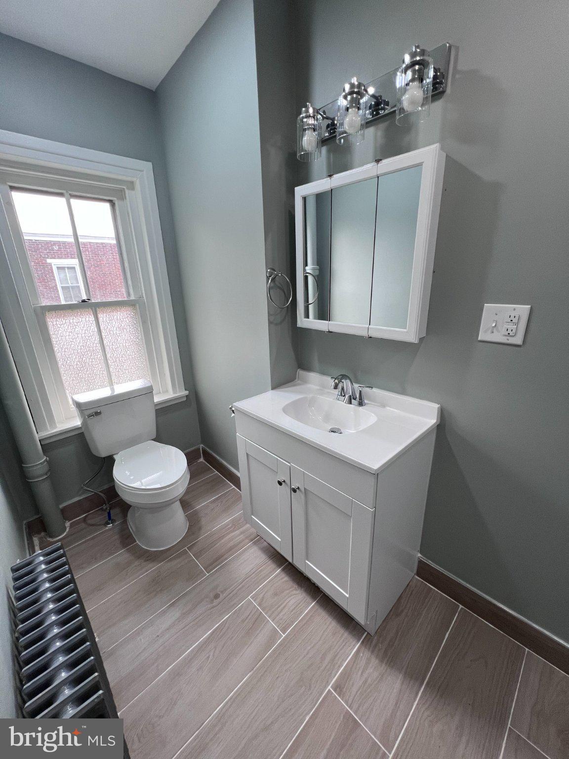 26 East 5th Street Pottstown, PA 19464 - Photo 22 of 37 a bathroom with a double vanity sink mirror and toilet