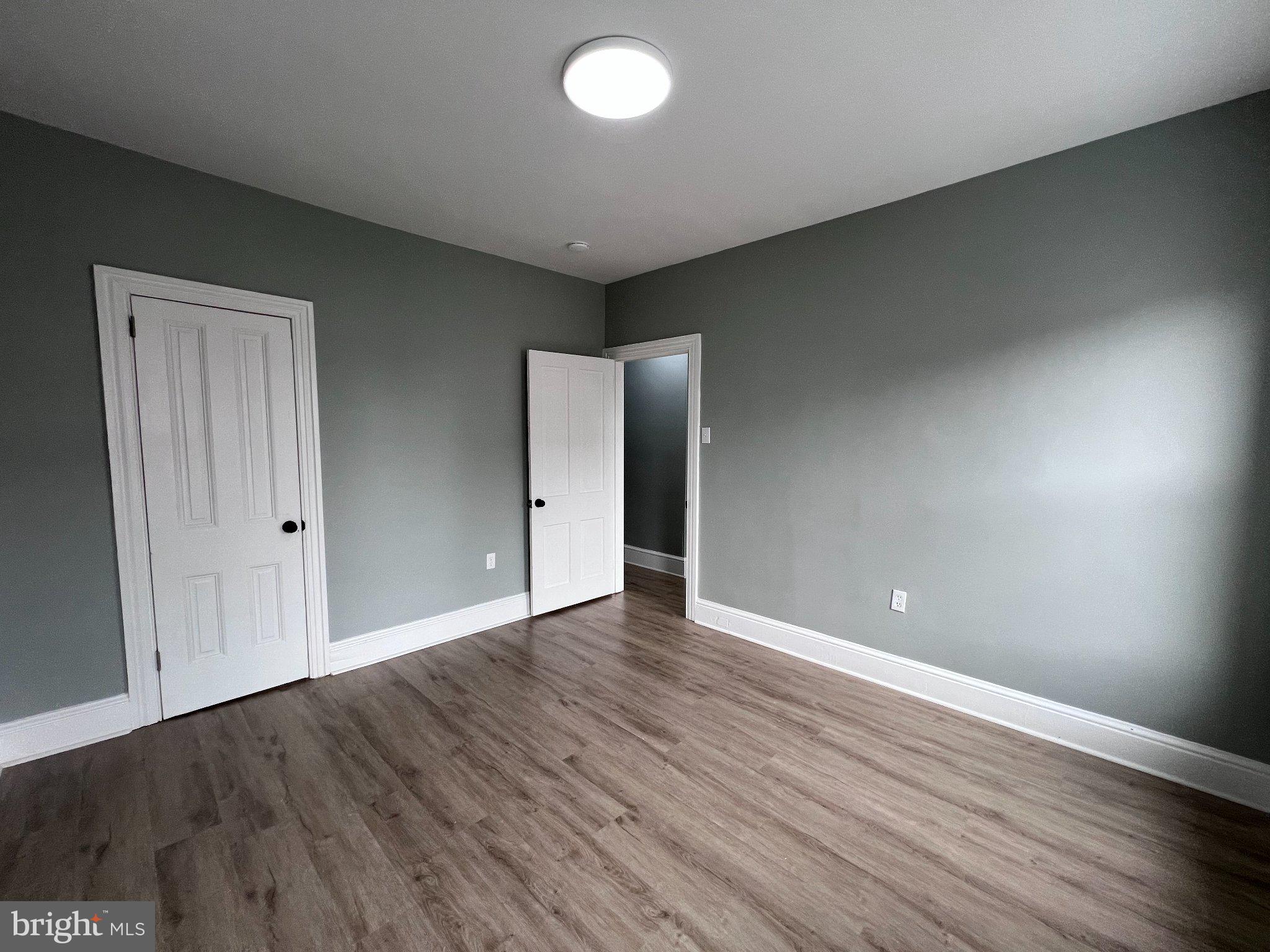 26 East 5th Street Pottstown, PA 19464 - Photo 27 of 37 a view of an empty room with wooden floor