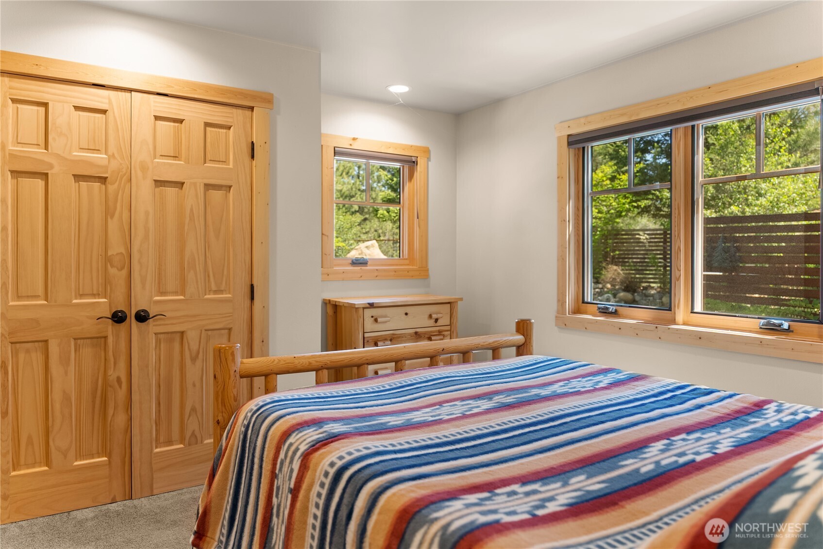 130 Sundown Road Winthrop, WA 98862 - Photo 22 of 40 a bedroom with a bed and a window