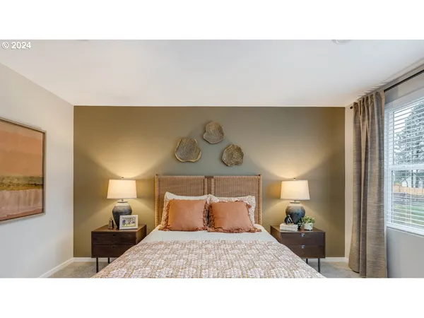a bedroom with a bed and window