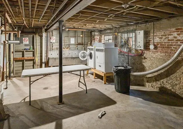 a view of a brick house with many windows