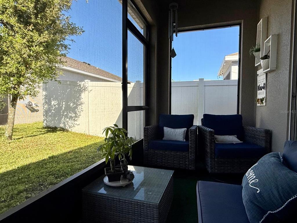813 Marcel Loop Davenport, FL 33837 - Photo 29 of 34 a dining room with furniture and a potted plant