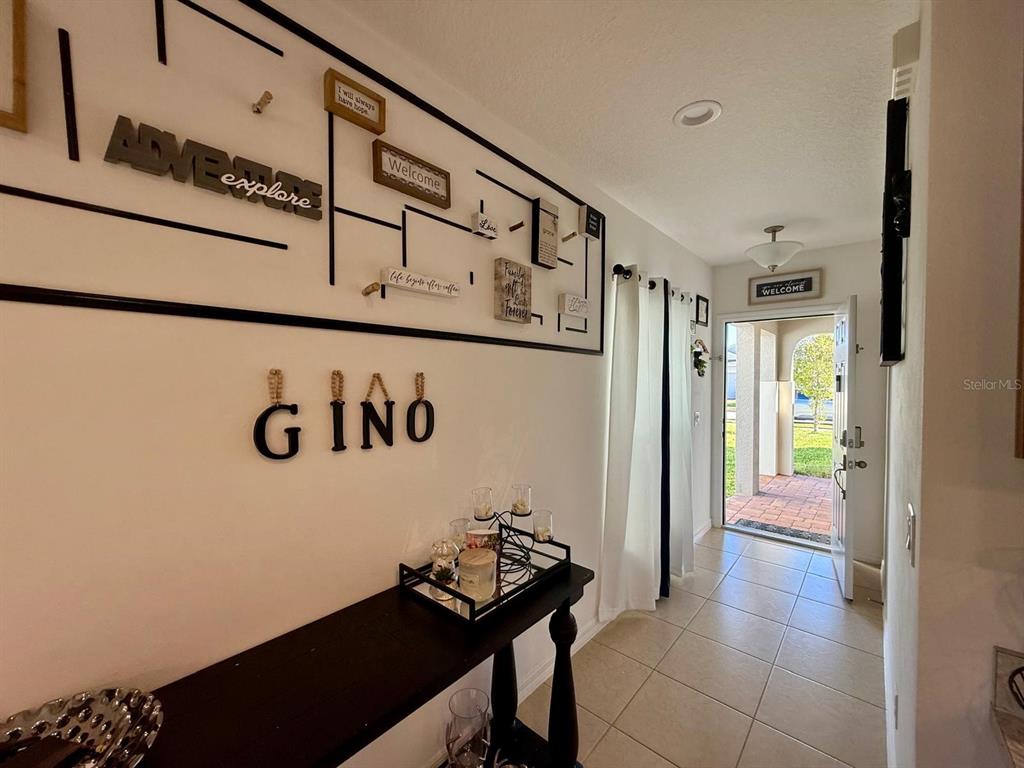 813 Marcel Loop Davenport, FL 33837 - Photo 3 of 34 a view of a hallway with seating area