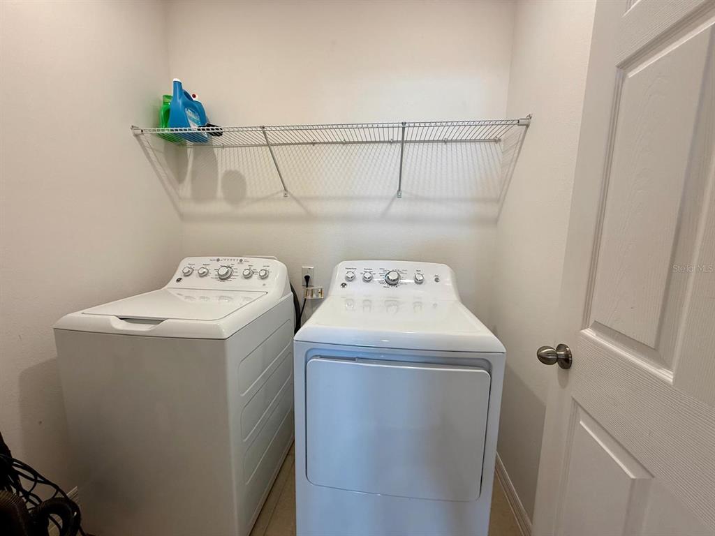 813 Marcel Loop Davenport, FL 33837 - Photo 34 of 34 a utility room with dryer and washer