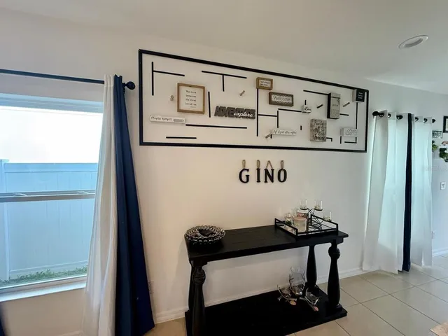 a kitchen with a sink a stove and a refrigerator
