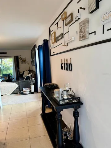 a kitchen with kitchen island a refrigerator stove microwave and cabinets