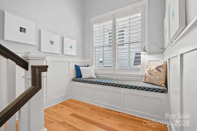 a spacious bedroom with a bed and a window