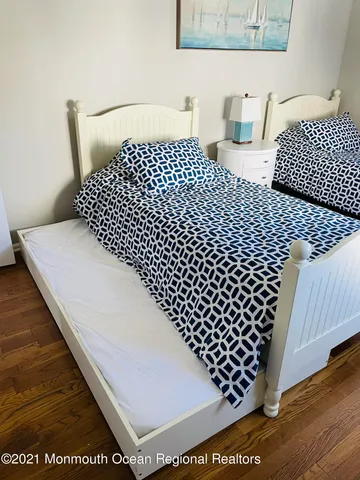 a bathroom with a black white checkered floor