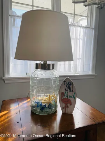 a view of a dining room with table and chairs