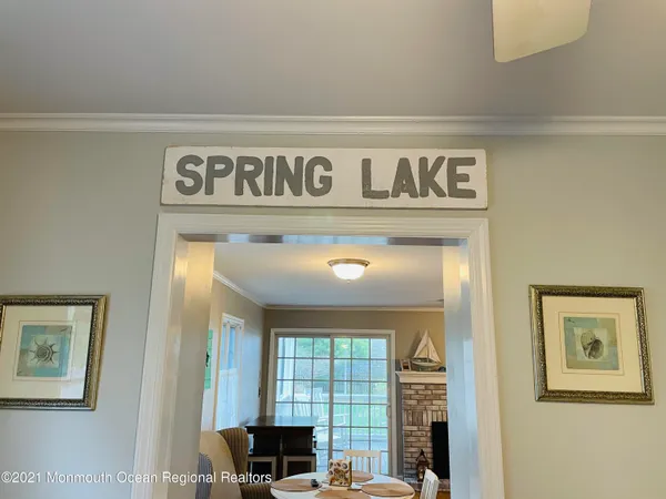 a view of a door and a living room