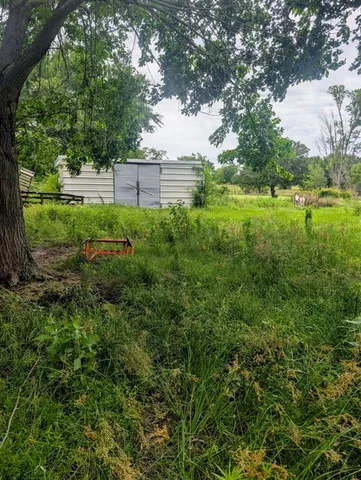 a view of outdoor space with deck and green space