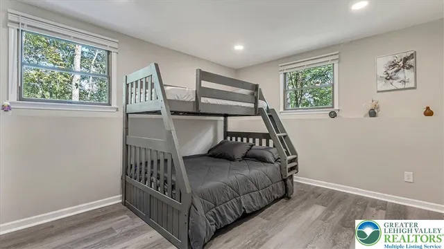 a bathroom with a bathtub toilet and a shower