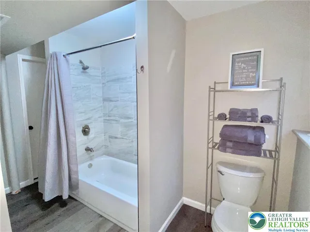 a view of an house with backyard space and patio