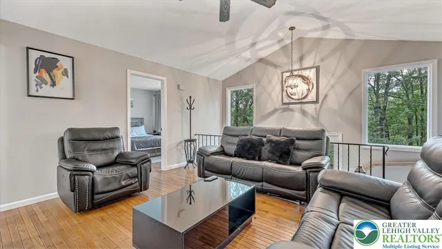a living room with furniture and a window