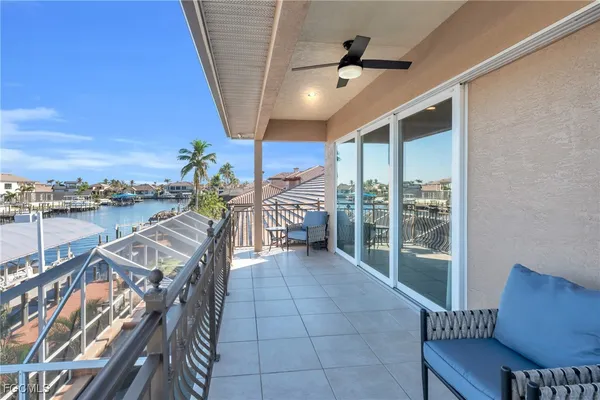 a view of a balcony with chairs