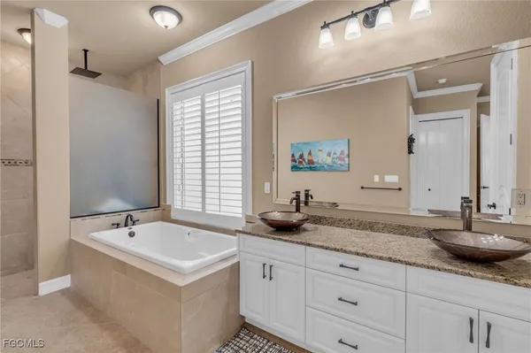 a bathroom with double sink and a mirror