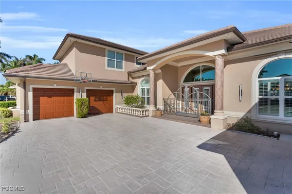 a front view of a house with garage