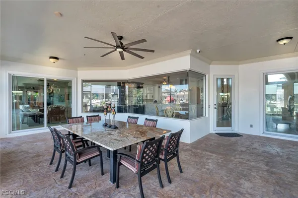 a dining room with furniture and window