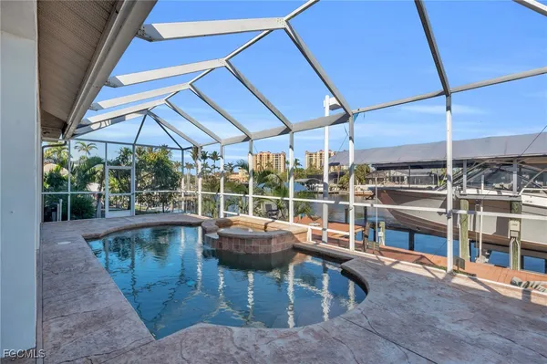a view of a swimming pool with a patio
