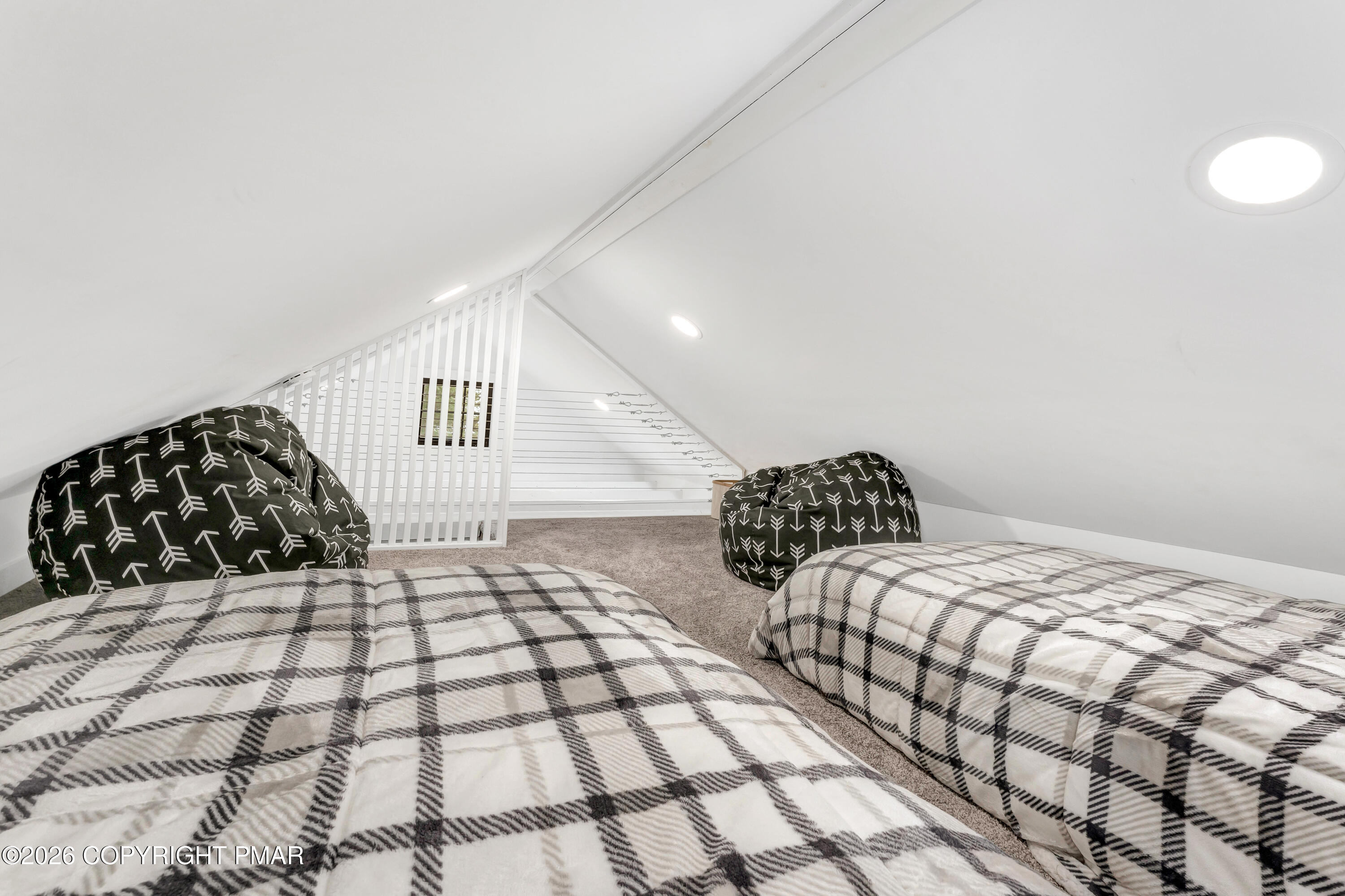 353 German Hill Road Shohola, PA 18458 - Photo 21 of 35 a bedroom with a bed and a black white checkered floor